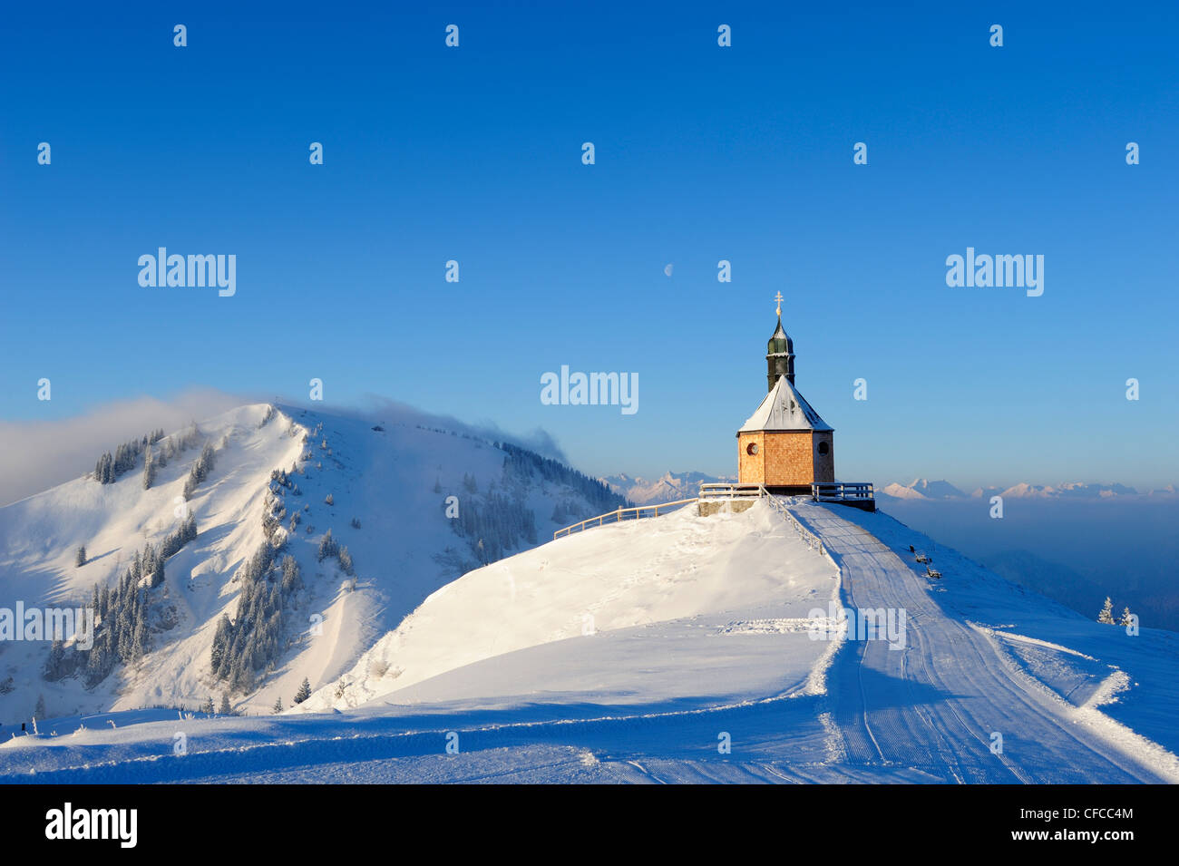 Snow covered chapel with Setzberg in the background, Wallberg, Bavarian alps, Upper Bavaria, Bavaria, Germany, Europe Stock Photo