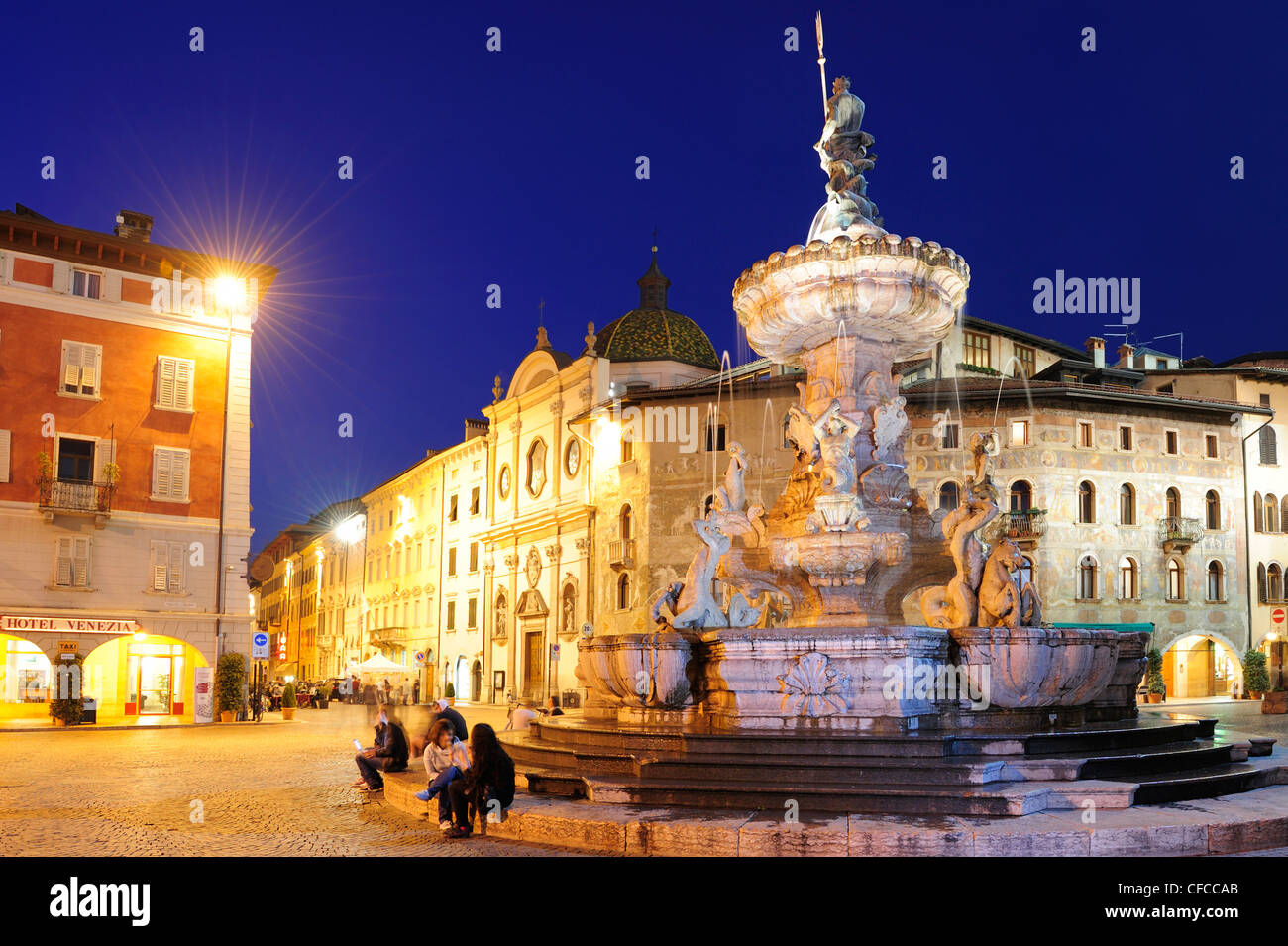 Illuminated fountain on the town square in Trento, Trento, Trentino, Italy, Europe Stock Photo