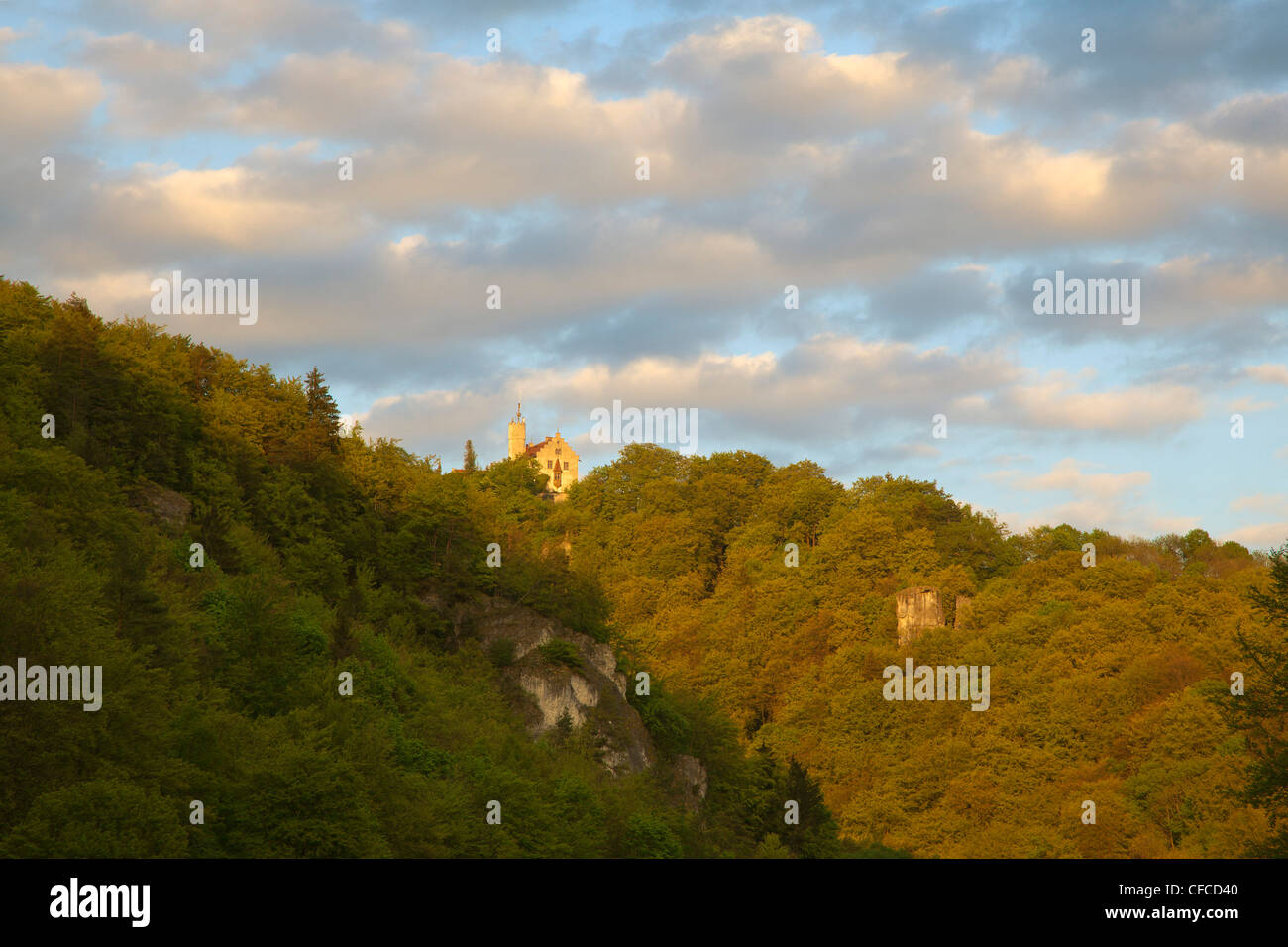 View from Wiesent valley onto Goessweinstein castle under clouded sky, Fraenkische Schweiz, Franconia, Bavaria, Germany, Europe Stock Photo