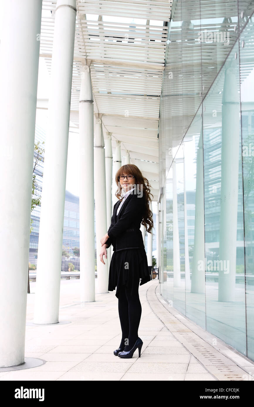 portrait of a young business woman in an office Stock Photo - Alamy