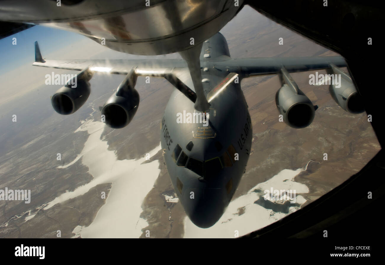 A 191st KC-135R Stratotanker, from the Utah National Guard Base, refuels a C-17 Globemaster from McCord Air Force Base March 5, 2012. Stock Photo