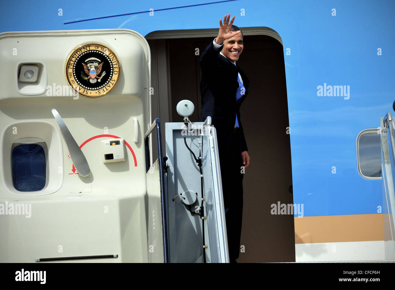 Charlotte, N.C. -- President Obama waves from Air Force One before departing Charlotte Douglas International Airport. The President was visiting a business in the local town of Mt. Holly, N.C. Stock Photo