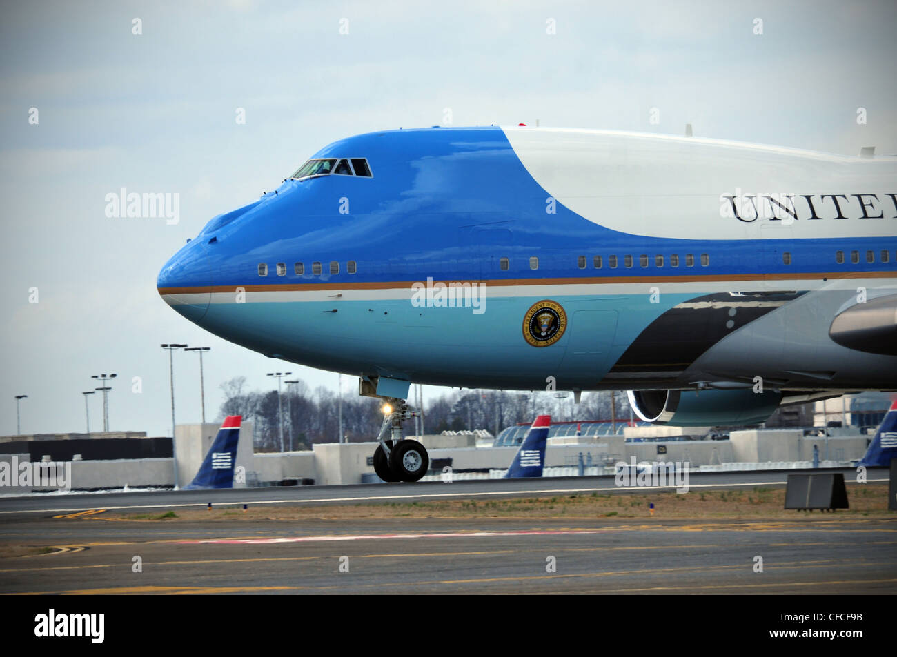Charlotte, N.C. -- Air Force One starts it take off roll from Charlotte Douglas International Airport after departing the 145th Airlift Wing. President Obama was visiting a business in the local town of Mt. Holly, N.C. Stock Photo