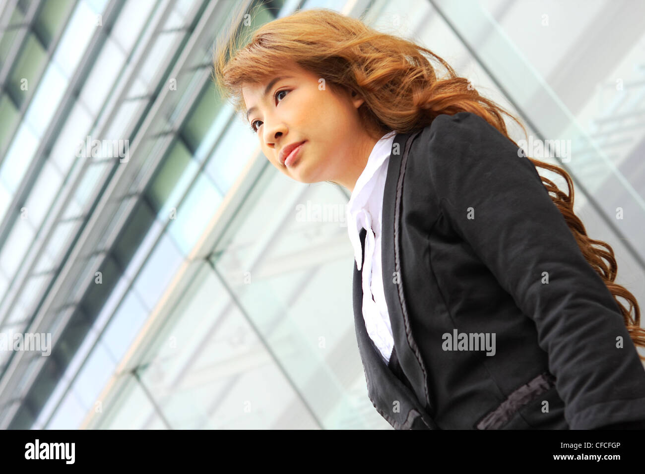 portrait of a young business woman in an office Stock Photo - Alamy