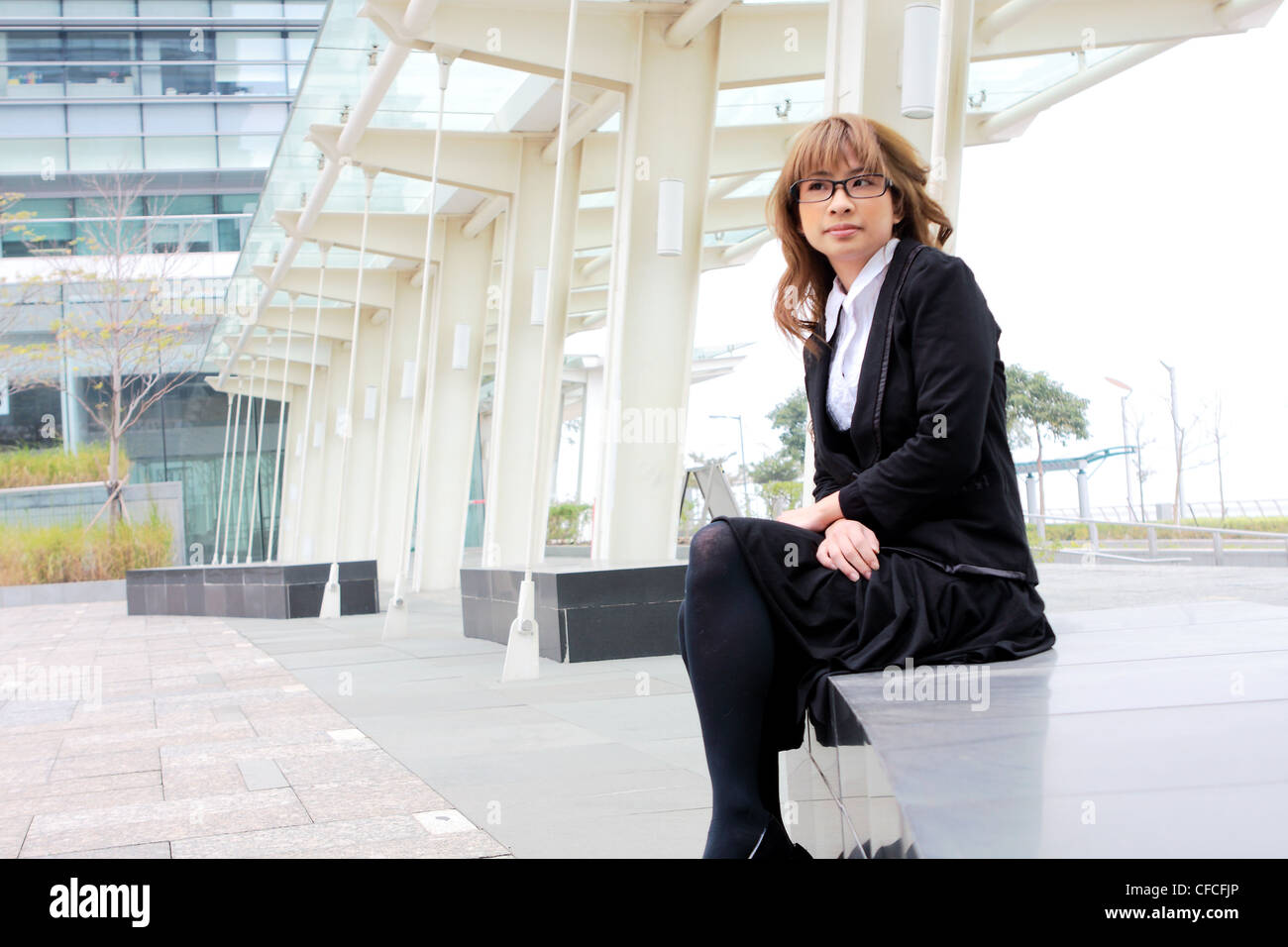 portrait of a young business woman in an office Stock Photo - Alamy