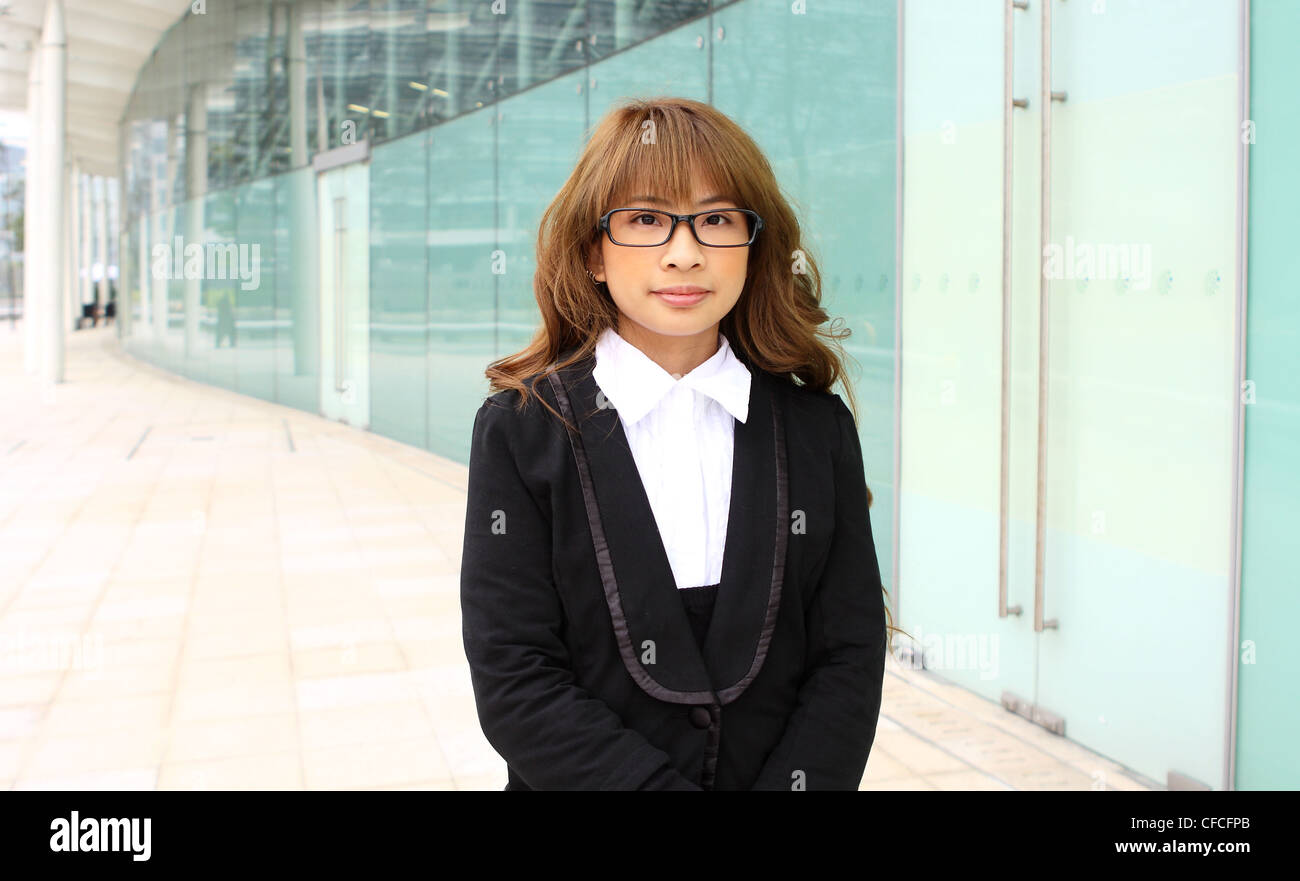 portrait of a young business woman in an office Stock Photo - Alamy
