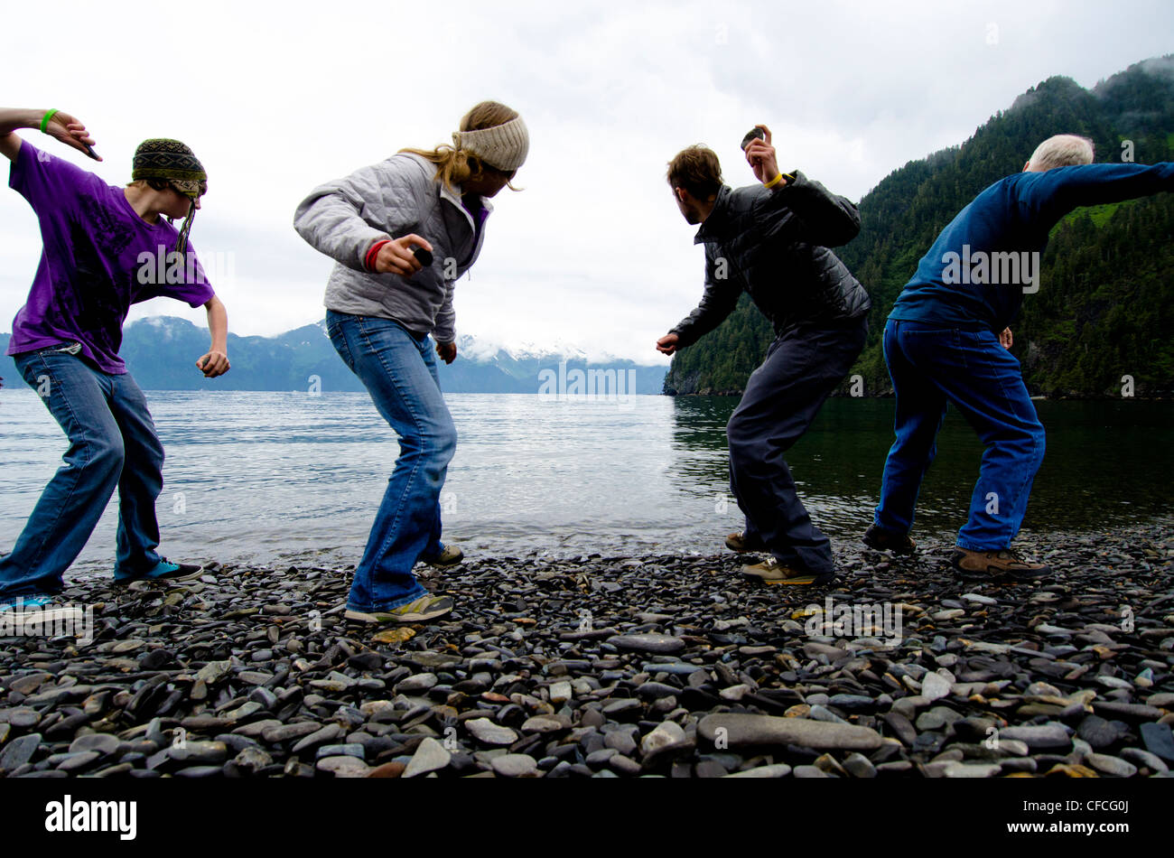 Ready, set, rock-skipping contest on Fox Island, Alaska. Stock Photo