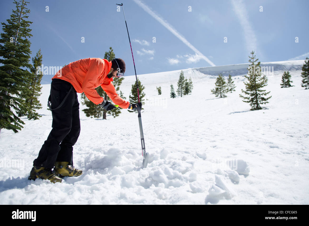 A young man practices avalanche training in Truckee, California Stock