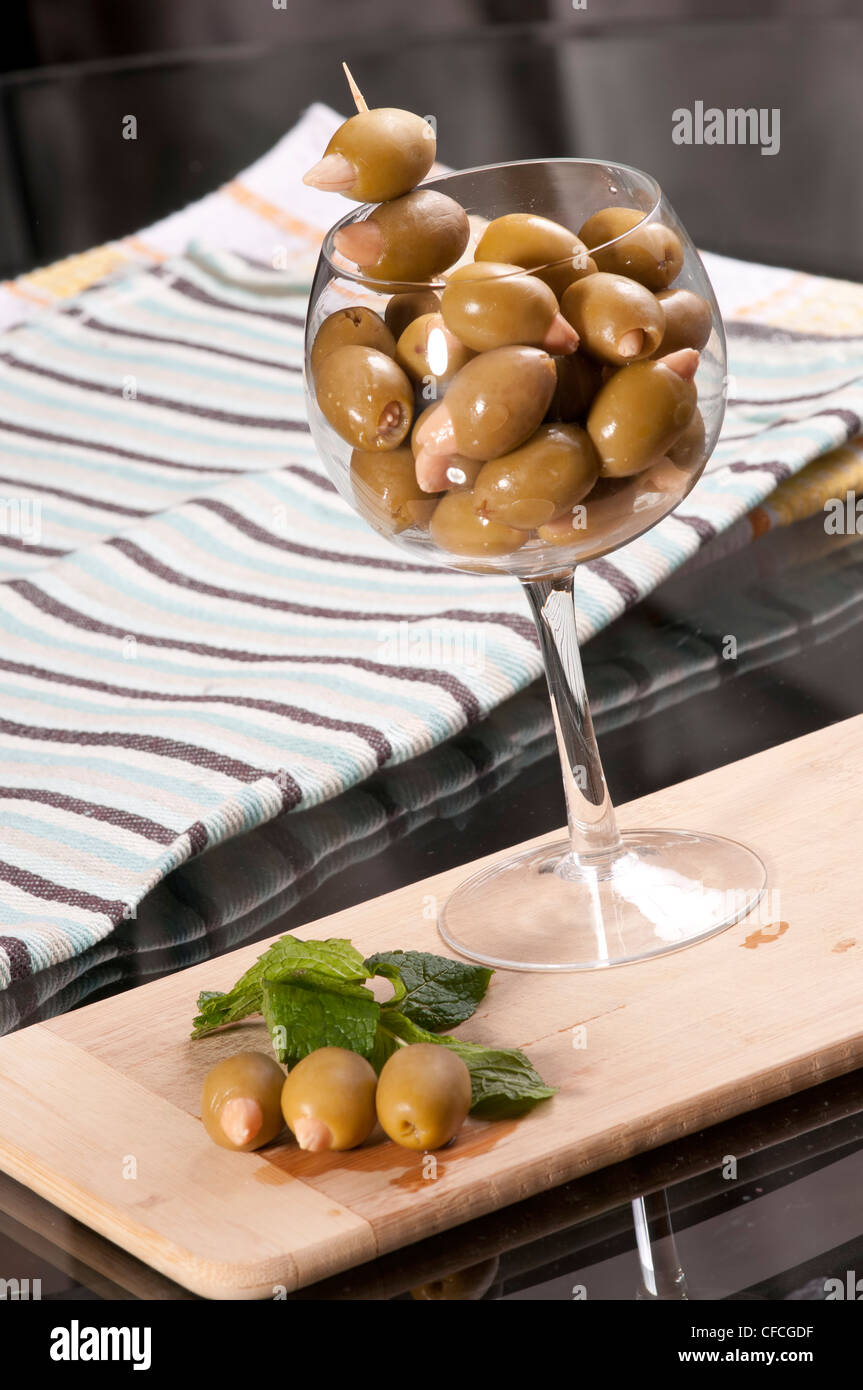 Almond stuffed olives in a wine glass Stock Photo Alamy