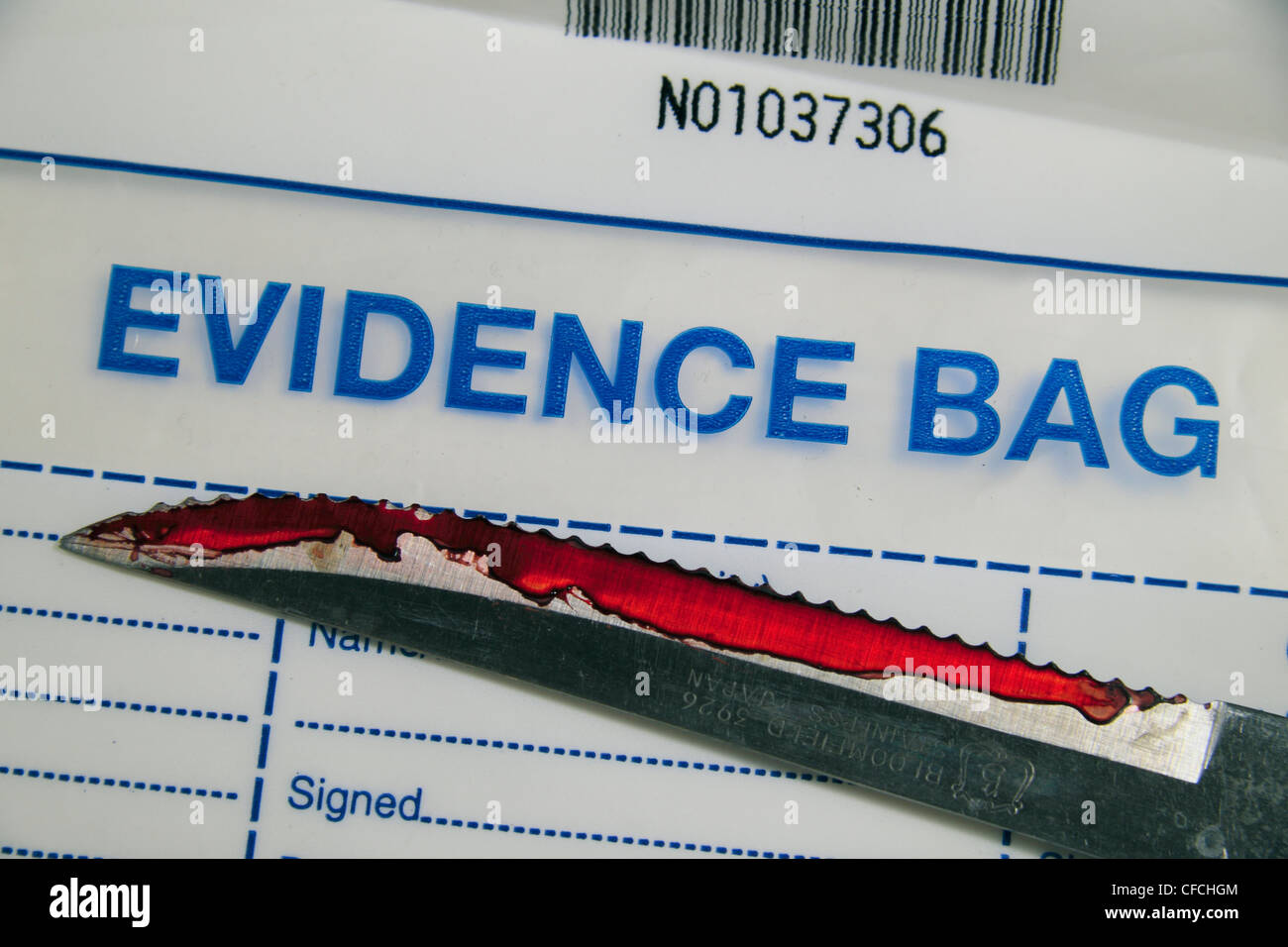 A simulated serrated edged bloodied knife on a British police Evidence Bag  (as used in the UK Stock Photo - Alamy