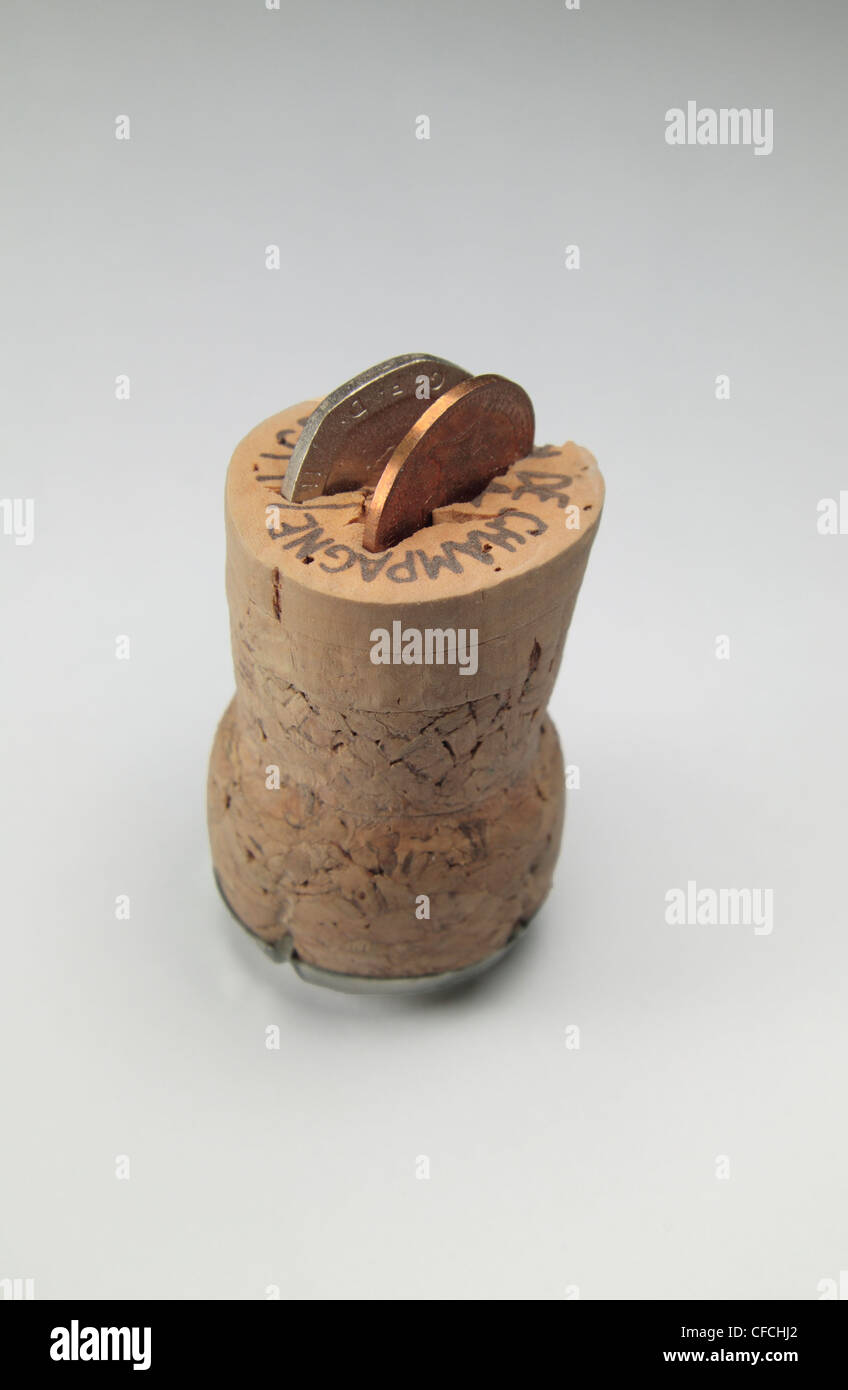 A Champagne cork with a 20p piece and 1p piece to symbolise turning 21 years old (in England). Stock Photo