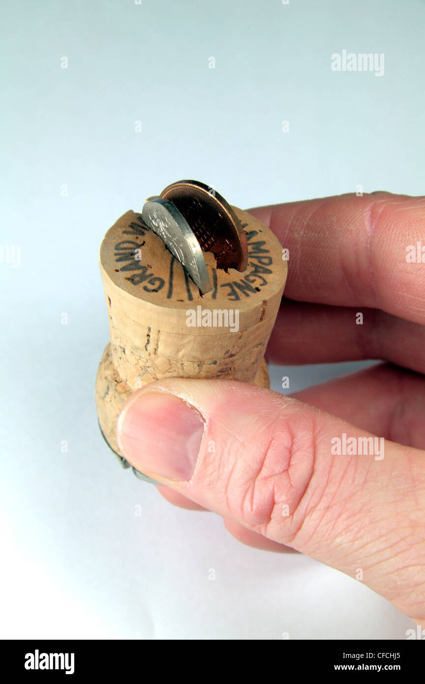 A Champagne cork with a 20p piece and 1p piece to symbolise turning 21 years old (in England). Stock Photo