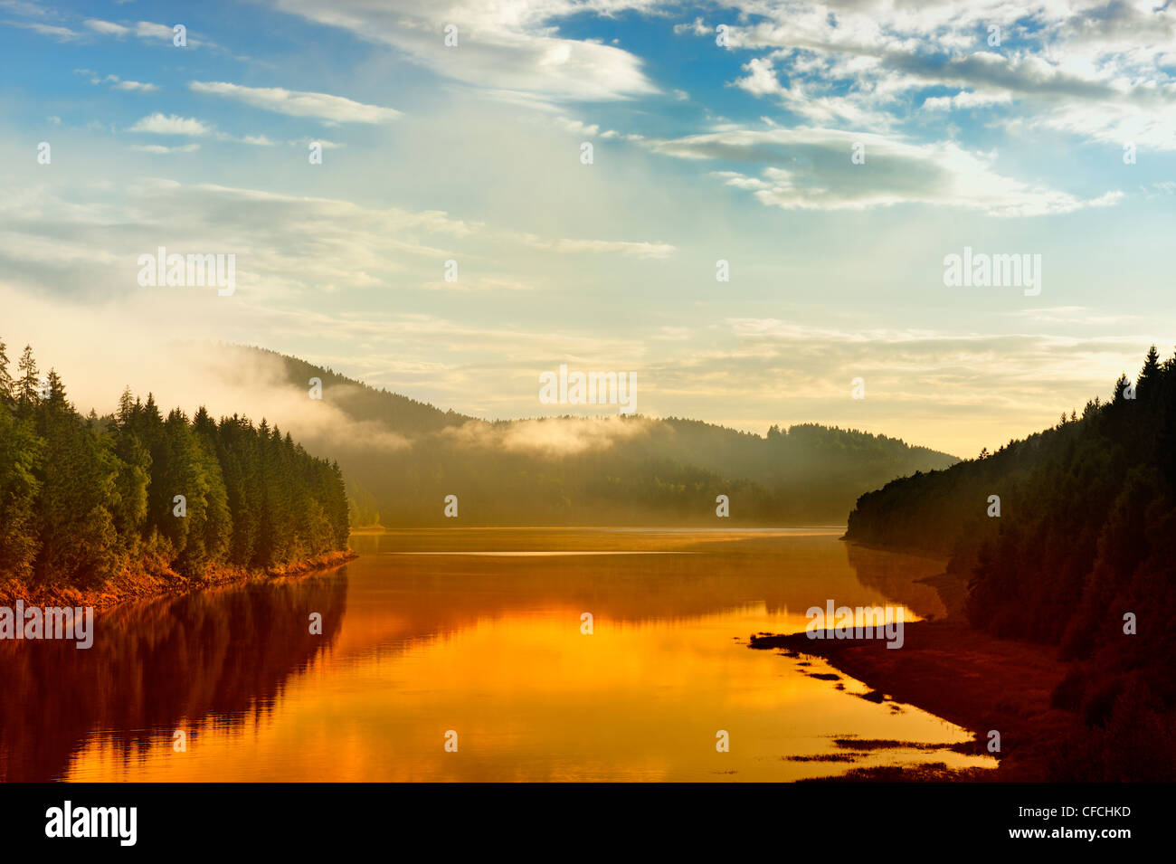 Golden sunbeam shine through the Sösestausee in Harz,Germany. Stock Photo