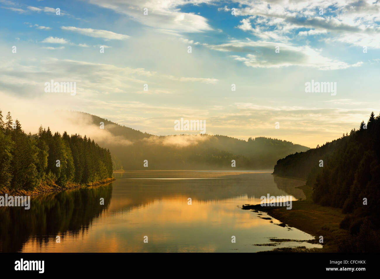 Golden sunbeam shine through the Sösestausee in Harz,Germany. Stock Photo