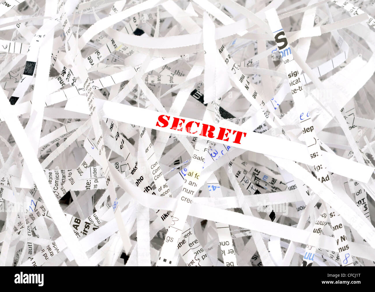 Secret text surrounded by shredded paper. Great concept for information protection Stock Photo