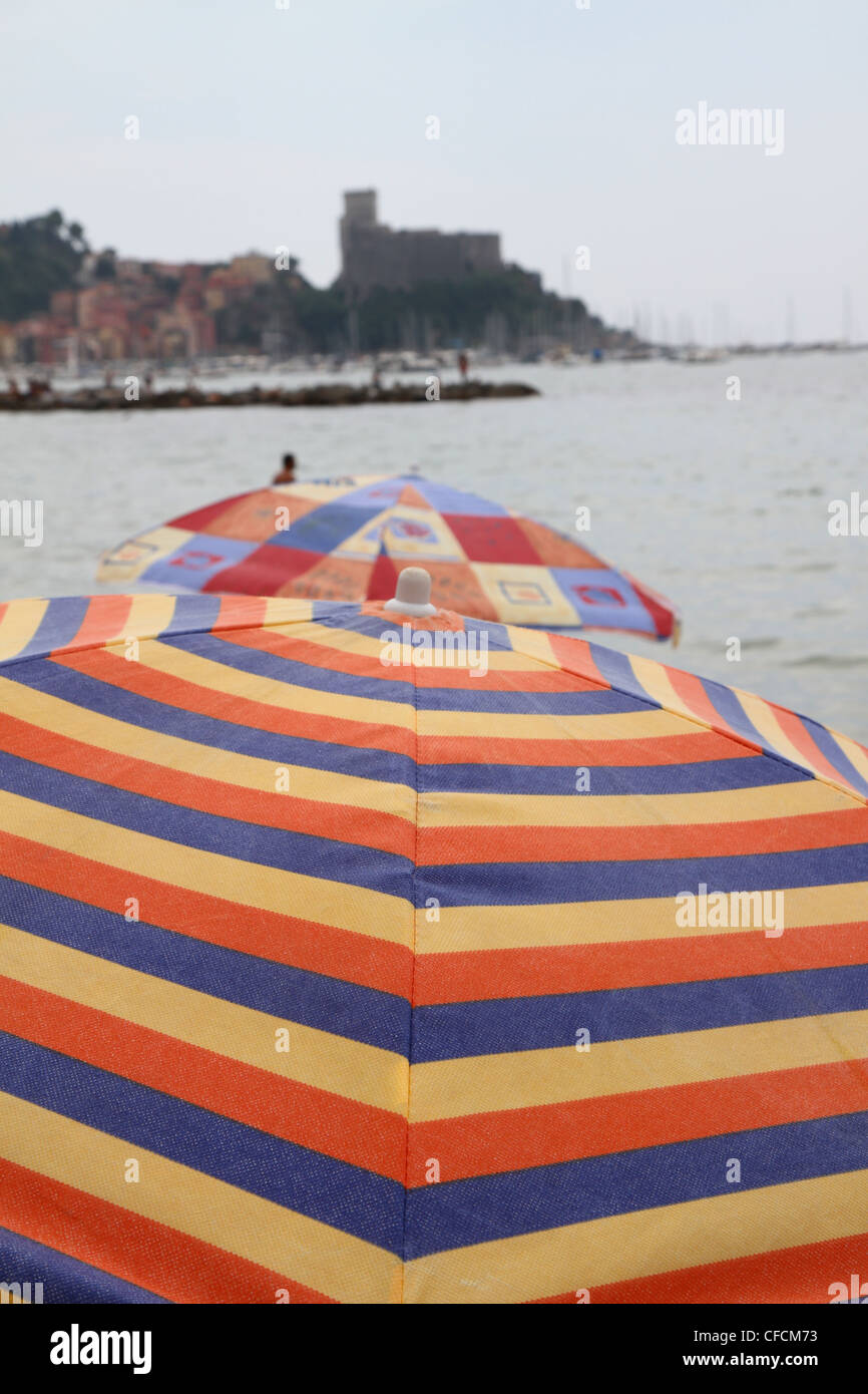 Colourful beach umbrellas in Lerici, Italy. Stock Photo
