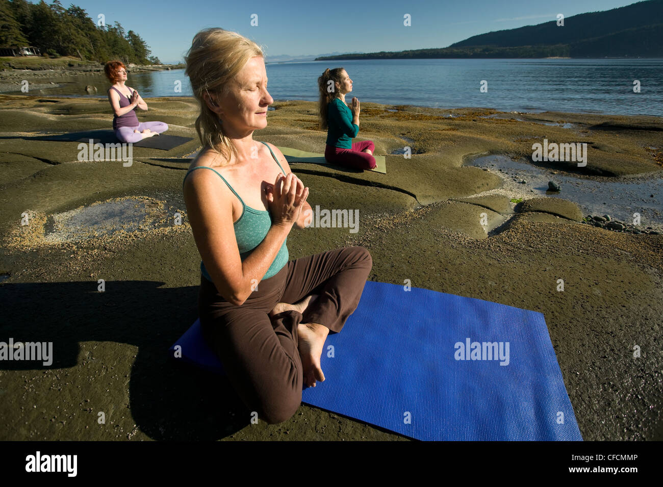 Yogpractioners meditate relax lotus position Stock Photo