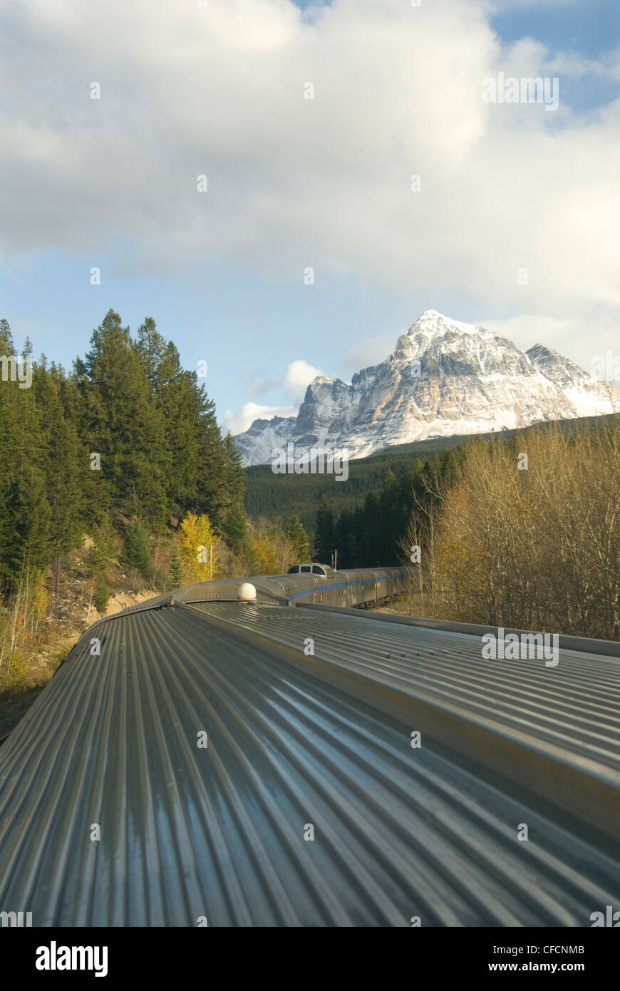 VIA's Candian makes its way through the Rocky Mountains east of Jasper, Alberta. Stock Photo