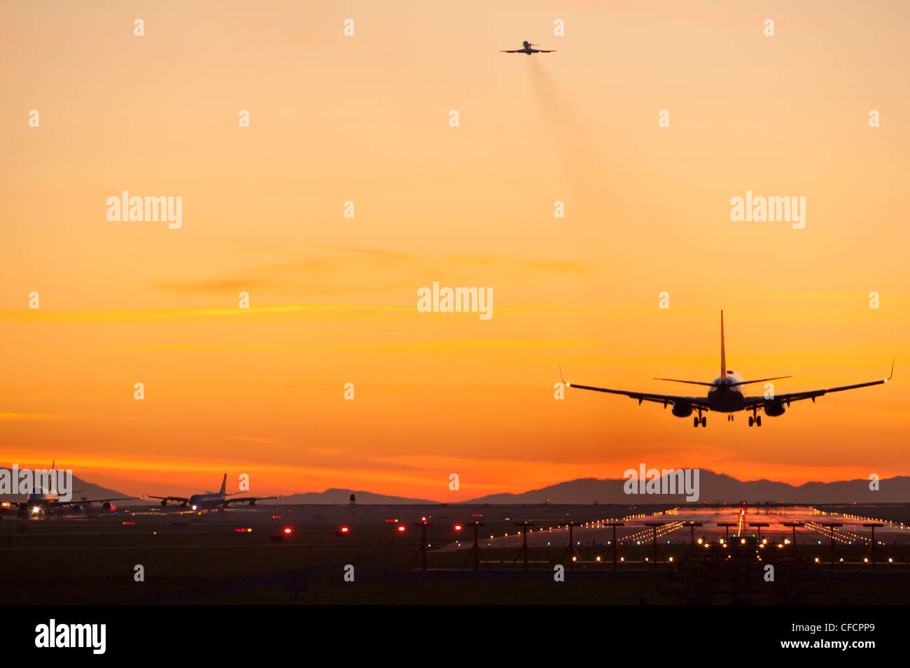 Inbound, outbound and taxiing aircraft. Stock Photo
