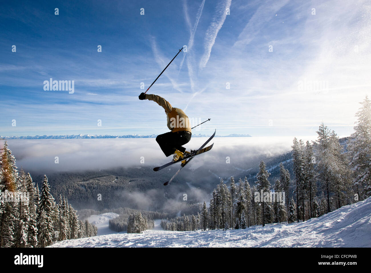 Tyler Ricketts catches air while skiing the bumps at Kimberley Alpine Resort, British Columbia, Canada. (model release #07120) Stock Photo