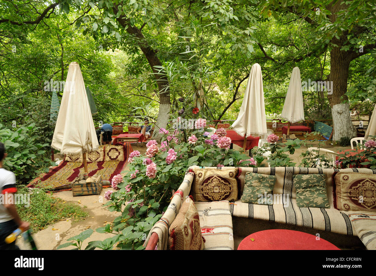 Waterfall at Setti Fatma, open air teahouse with plushy cushions at High Atlas, Morocco, Africa Stock Photo