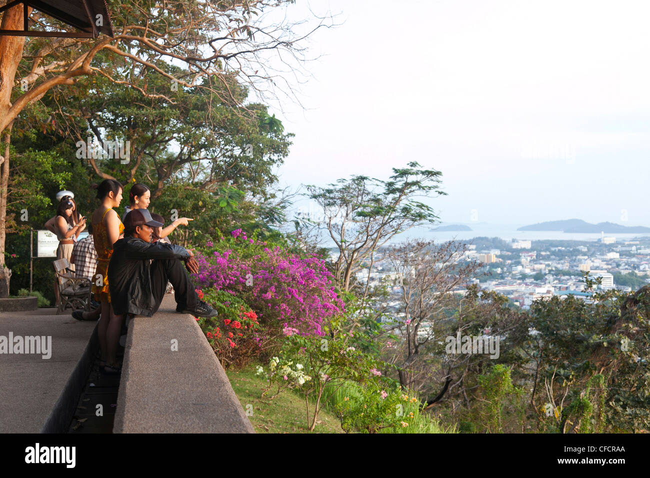 Thai people enjoying the view from Rong Hill over the city at sunset, Phuket, Thailand, Asia Stock Photo
