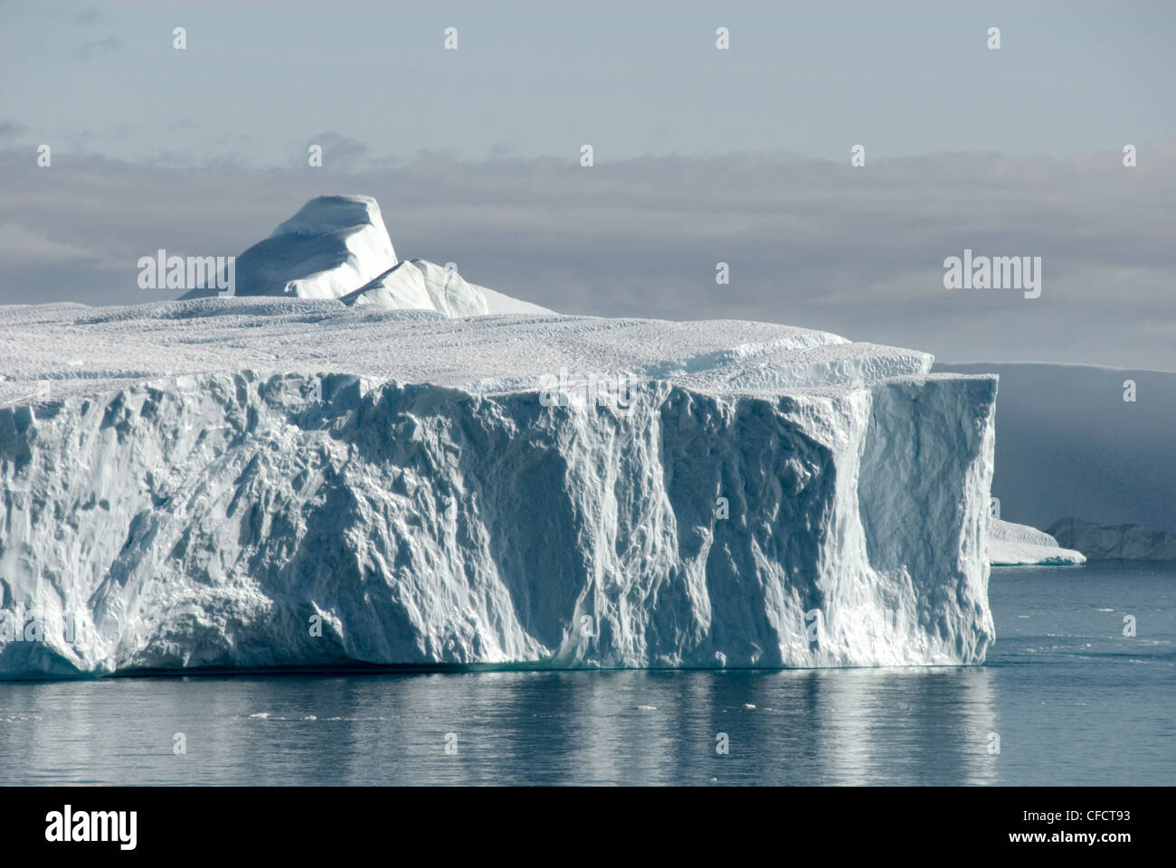 Tabular iceberg emerging from Kangia Ice Fjord, next to Ilulissat, Disko Bay, Greenland, Polar Regions Stock Photo