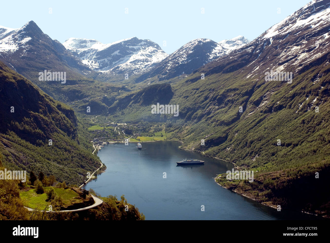 Cruise ships at head of Geiranger Fjord, with the Dalsnibba snow peaks beyond, west coast, Norway Stock Photo