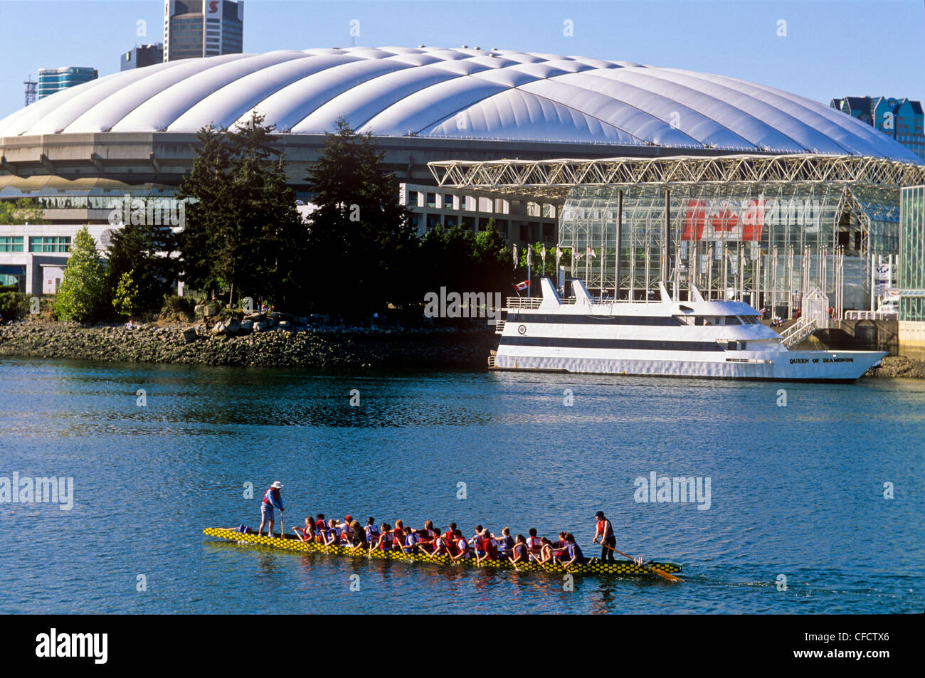 Dragon boat and Plaza of Nations, False Creek, Vancouver, British Columbia, Canada Stock Photo