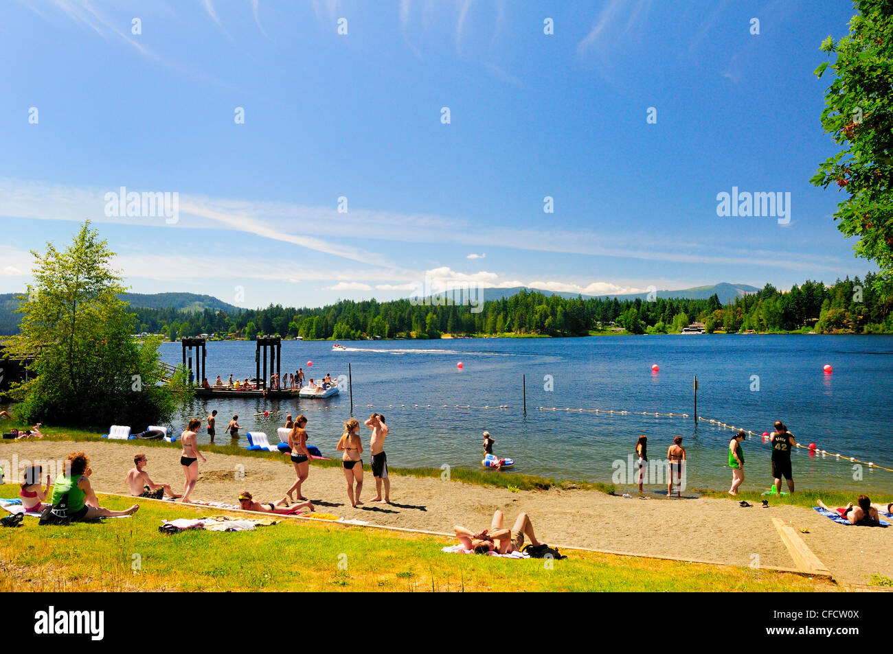 People enjoying boating and the beach at the Government Wharf on
