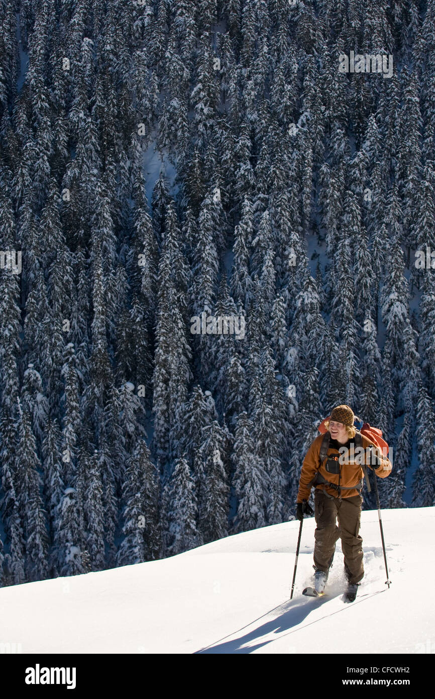 A male freeskier backcountry skiing in Roger's Pass, Glacier National Park, British Columbia, Canada Stock Photo