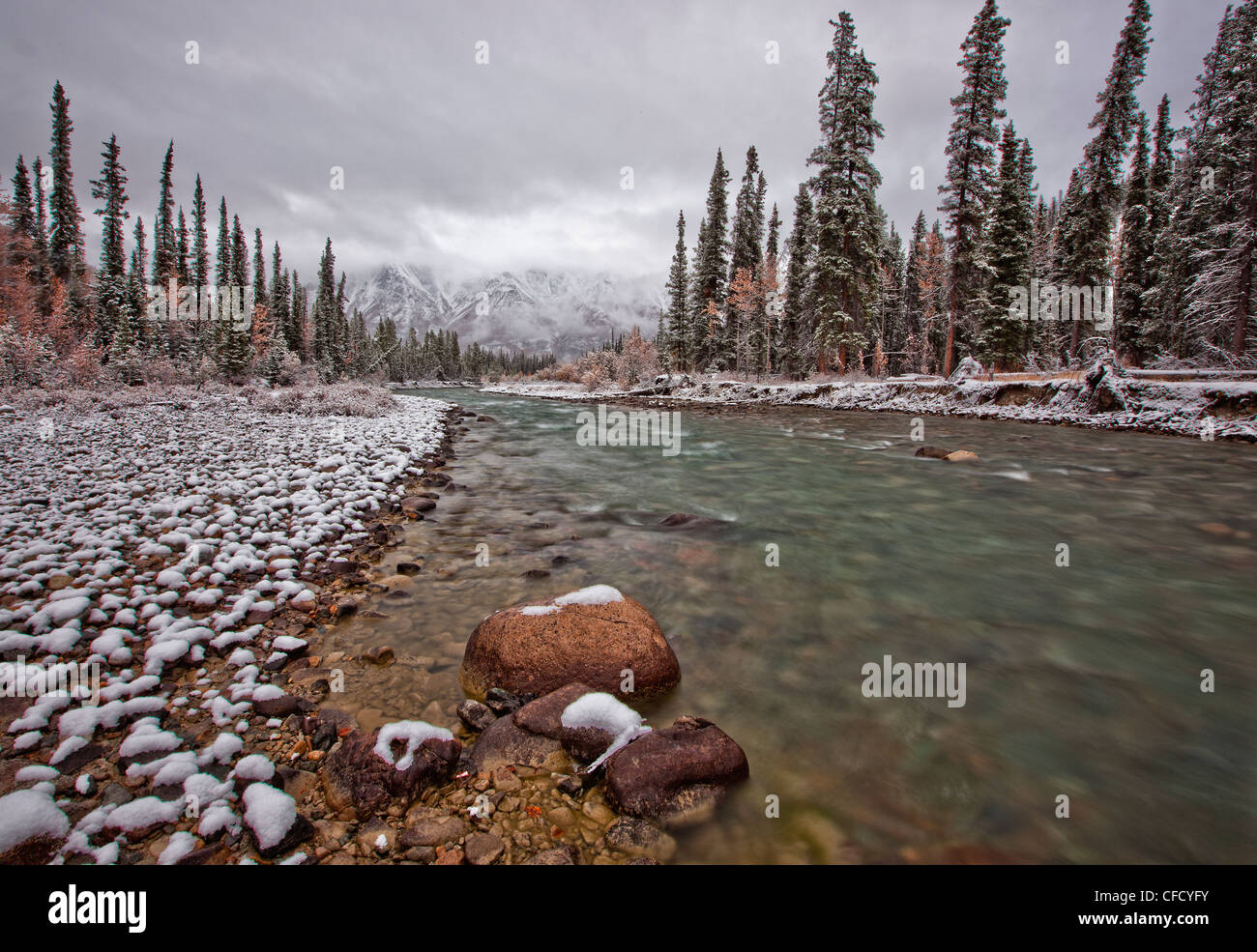 The Wheaton River continues to run with the snow coating the rocks
