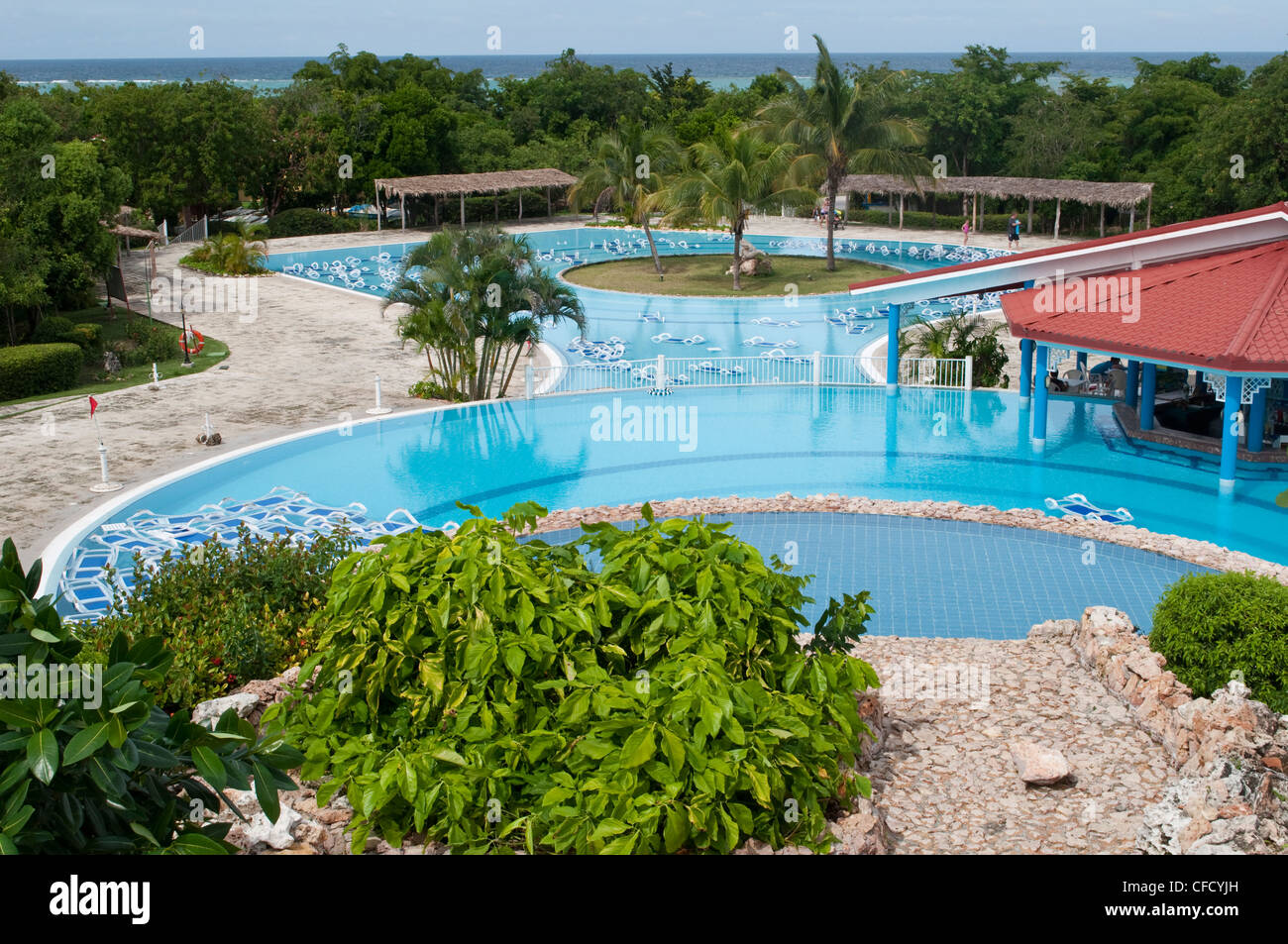 Pre hurricane preparation with lounge chairs placed in pools near Holguin, Cuba Stock Photo