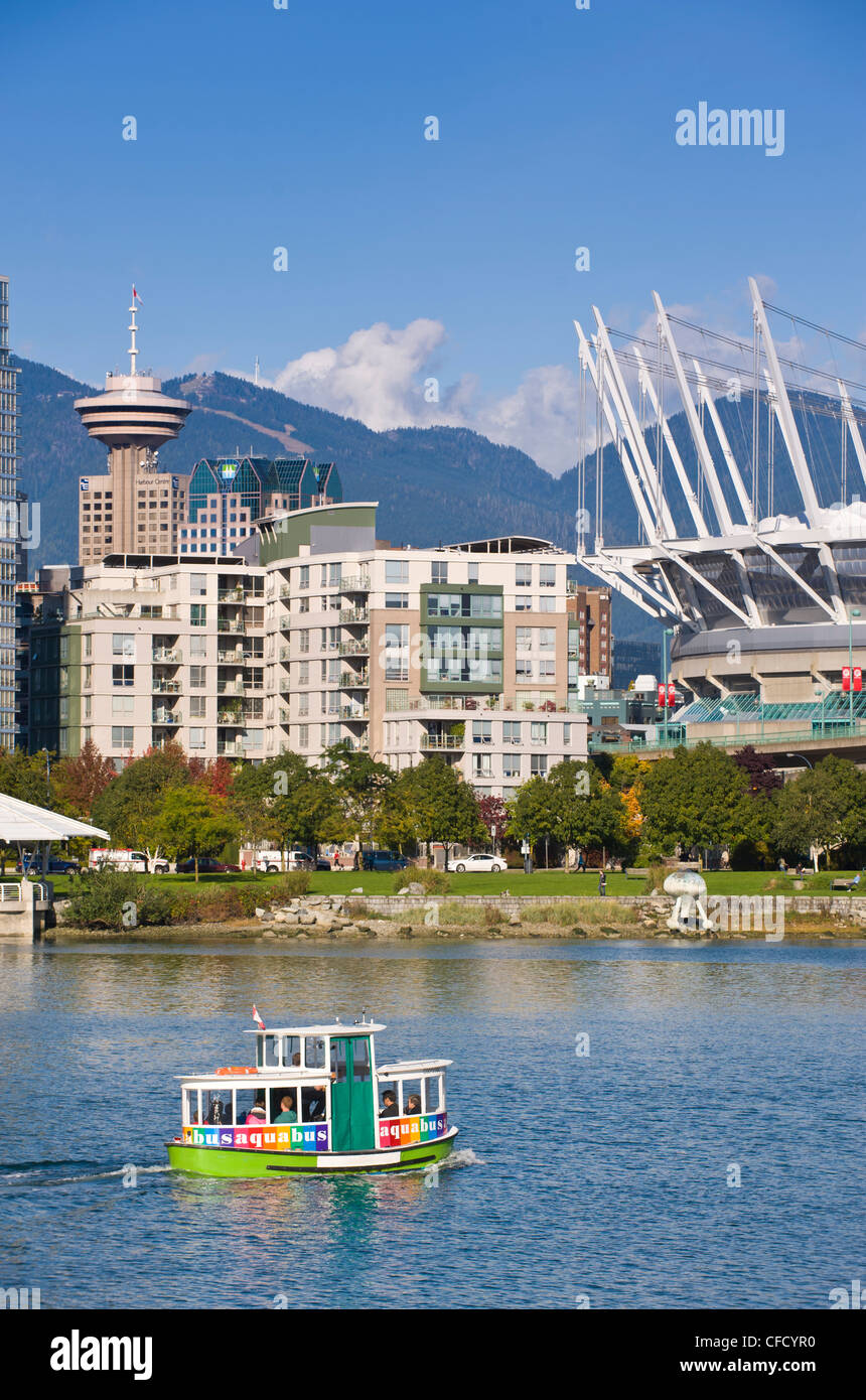 Aquabus Ferry, city skyline with new retractable roof on BC Place Stadium, False Creek, Vancouver, British Columbia, Canada Stock Photo