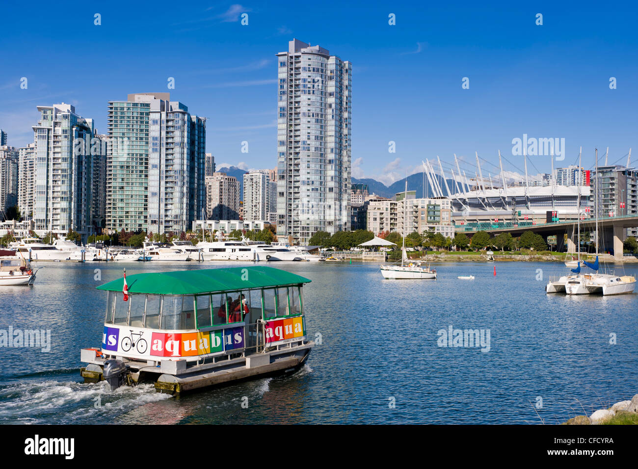 Aquabus Ferry, city skyline with new retractable roof on BC Place Stadium, False Creek, Vancouver, British Columbia, Canada Stock Photo