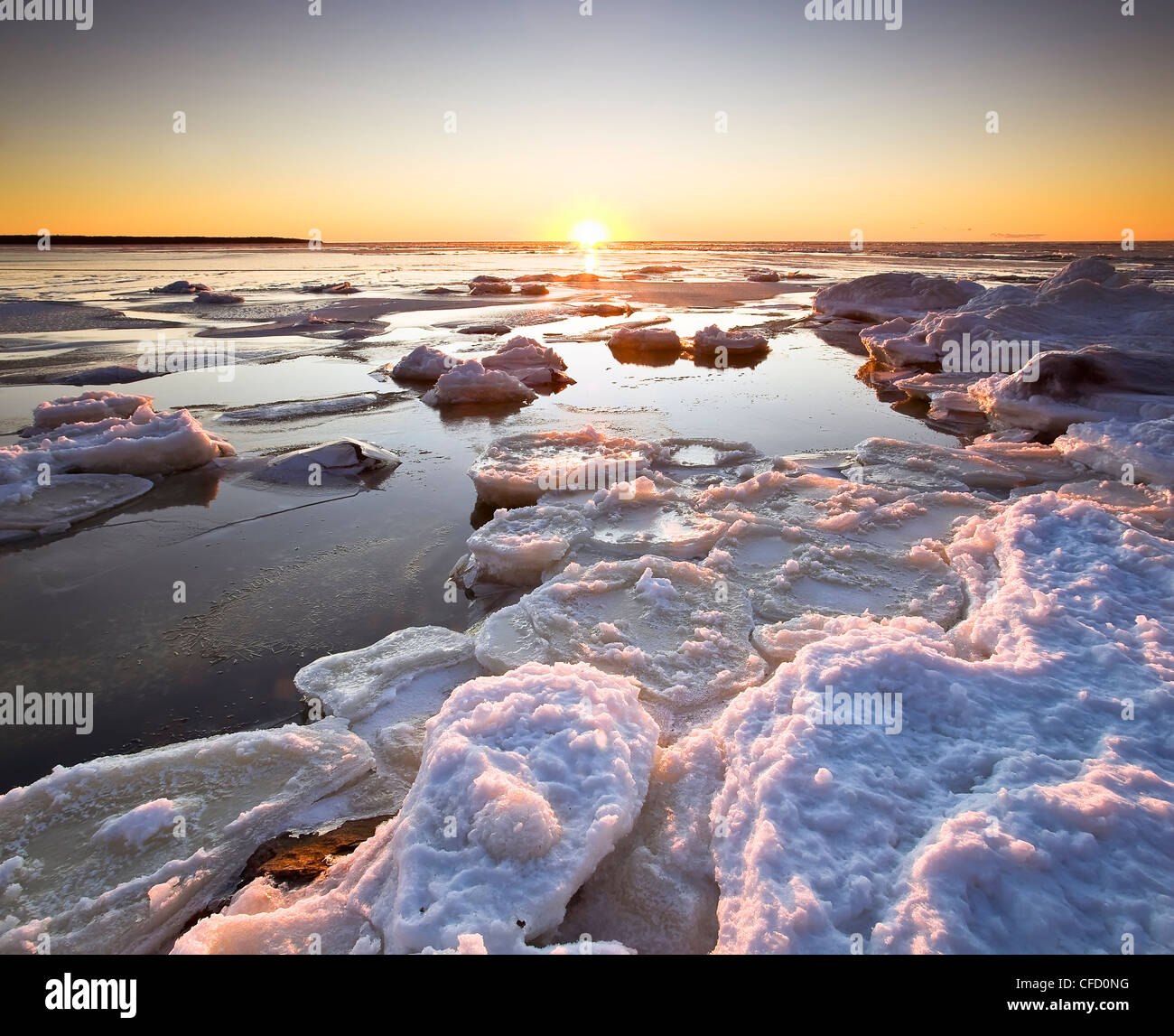 Ice flows on Lake Winnipeg at sunset. Victoria Beach, Manitoba, Canada. Stock Photo