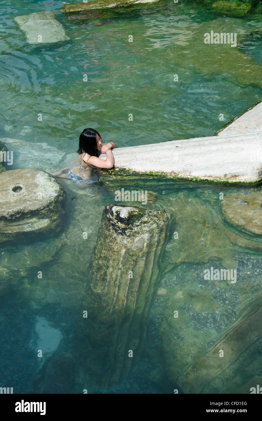 Pamukkale hot springs swimmers amongst columns, in Denizli Province in southwestern Turkey Stock Photo