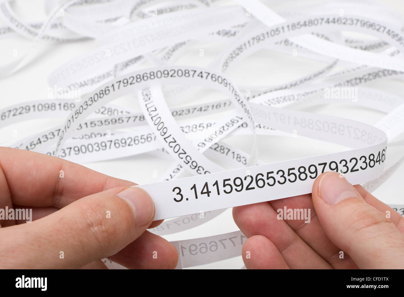 Researcher holding start of printout of the number PI Stock Photo