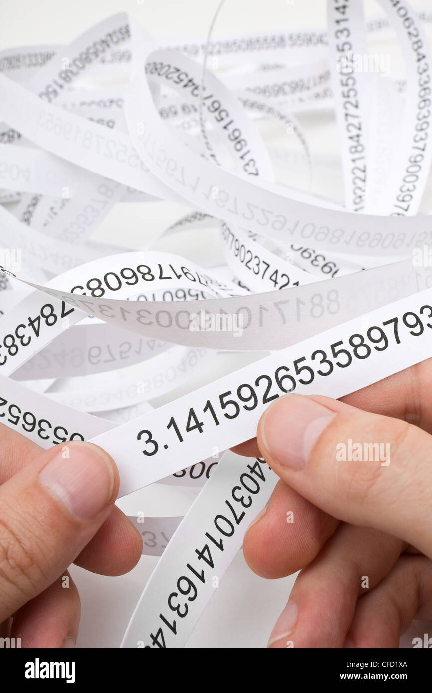 Researcher holding start of printout of the number PI Stock Photo