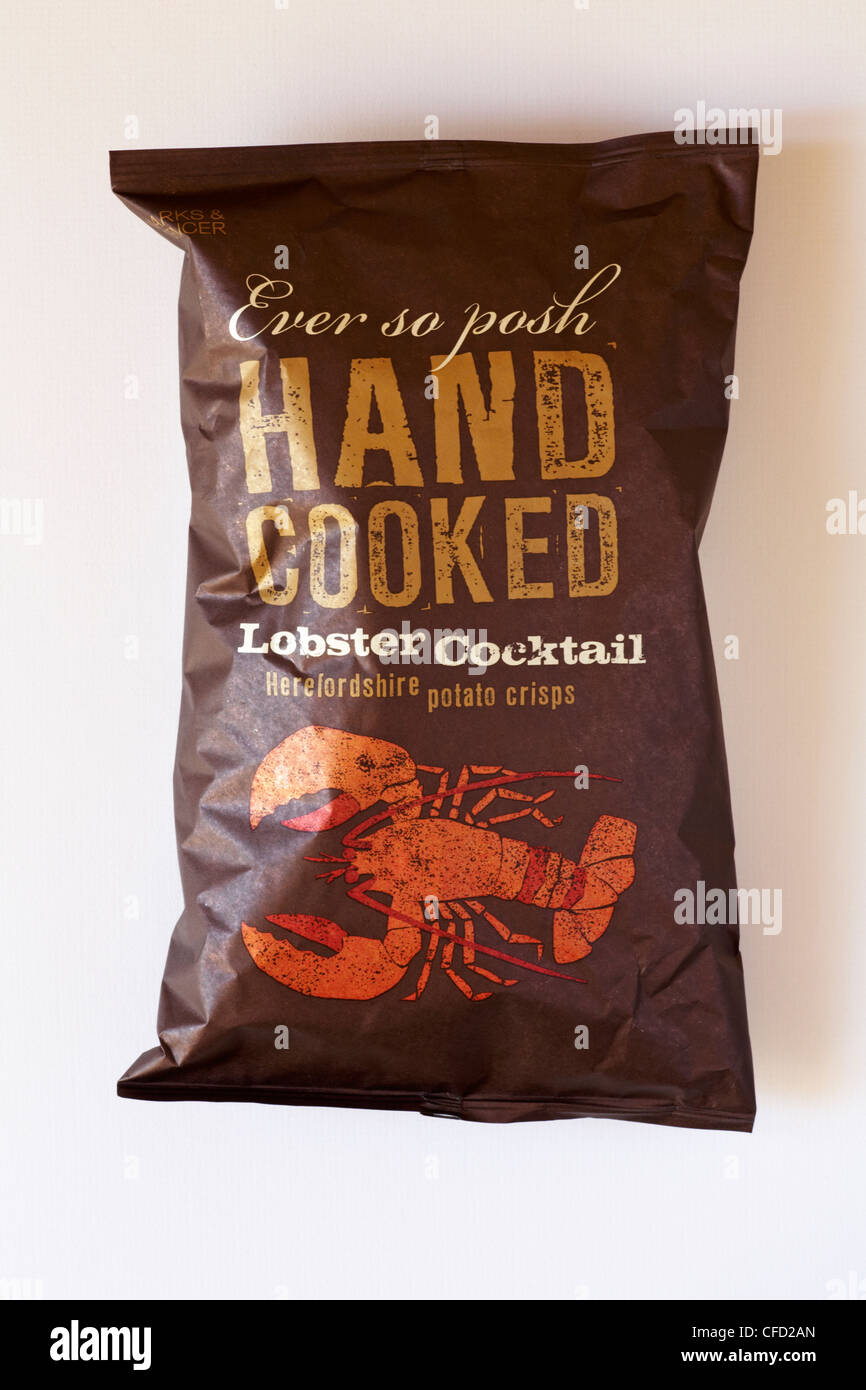 packet of Marks & Spencer Ever so Posh hand cooked Lobster cocktail Herefordshire potato crisps isolated on white background Stock Photo