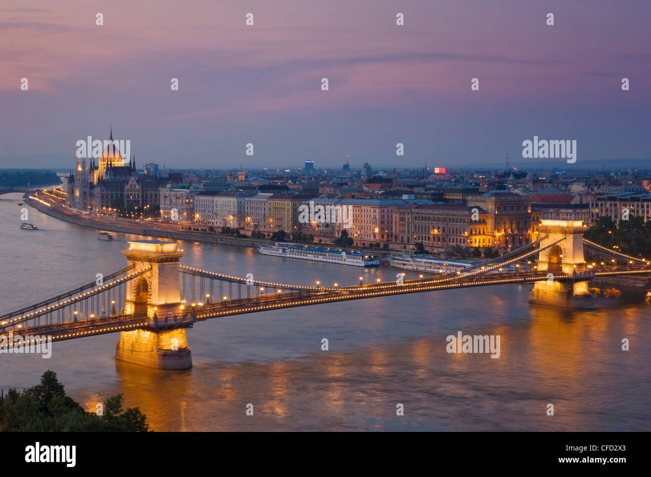 Panorama of the Hungarian Parliament, and the Chain bridge (Szechenyi Lanchid), over the River Danube, Budapest, Hungary Stock Photo