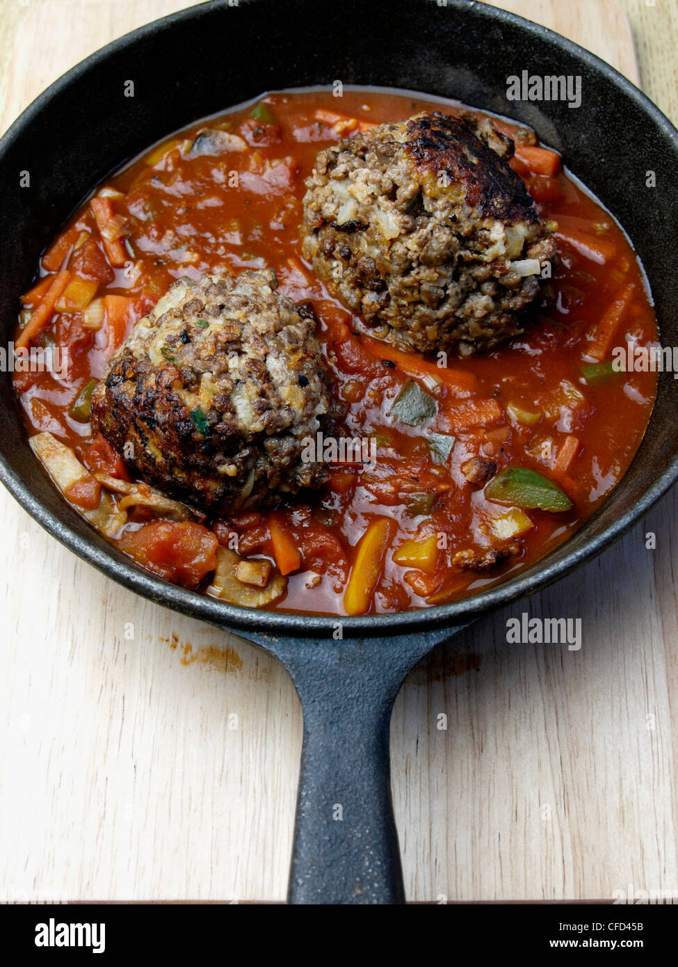 Vegetarian cheese filled meatball in a spicy tomato sauce Stock Photo