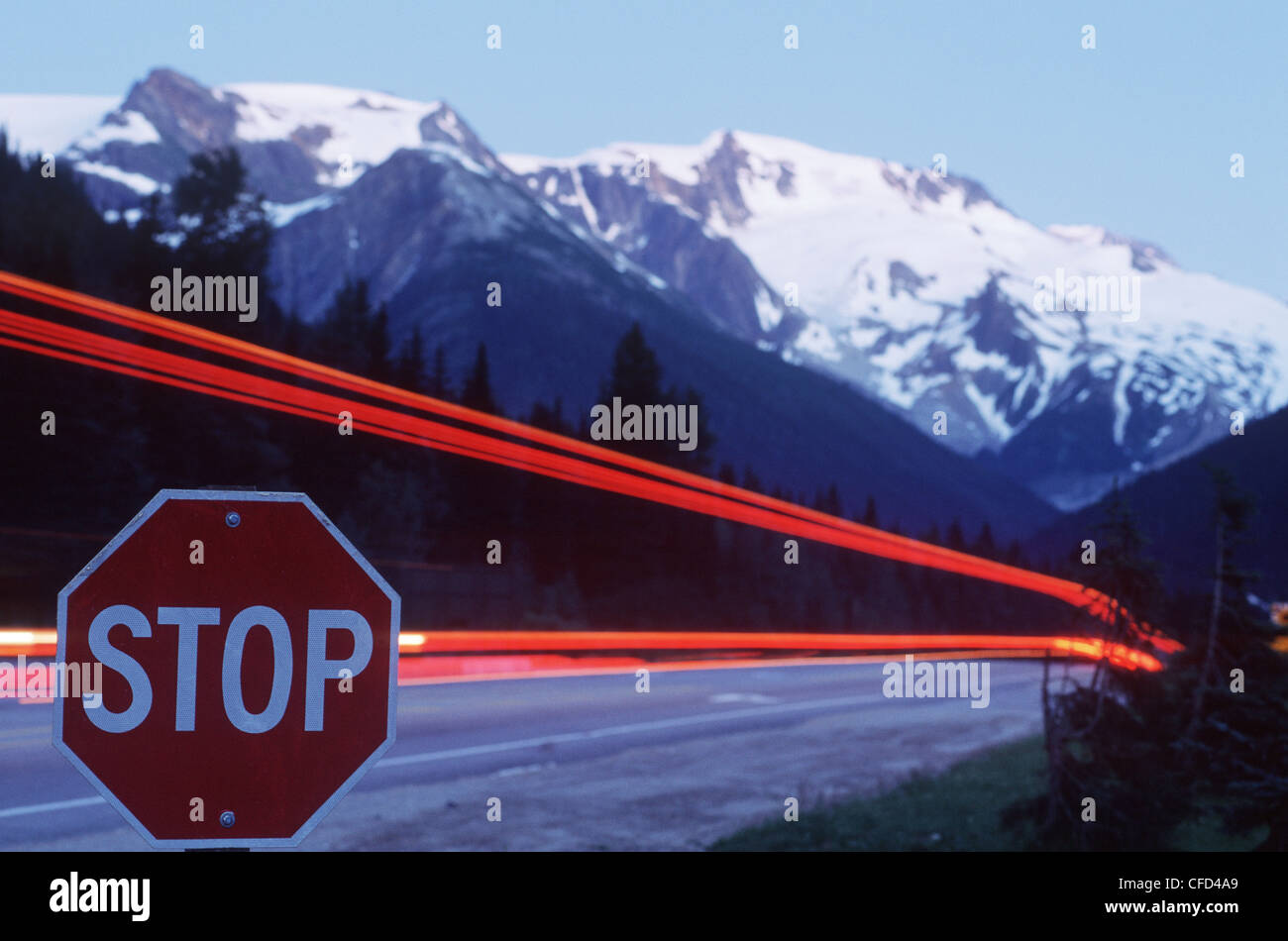 Rogers Pass, time exposure of highway at stop sign, British Columbia, Canada. Stock Photo