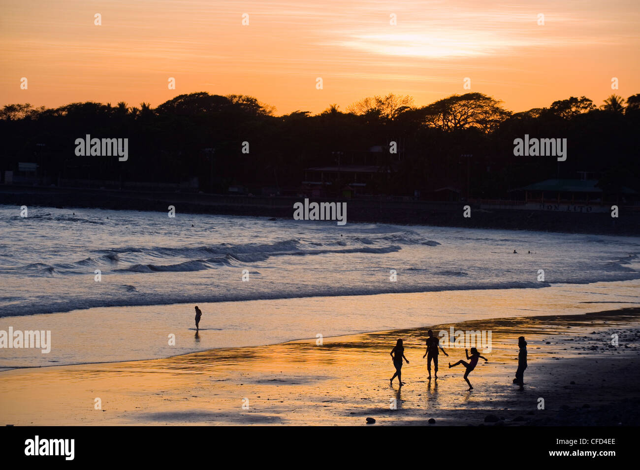 People playing football on the beach at La Libertad, Pacific Coast, El Salvador, Central America Stock Photo