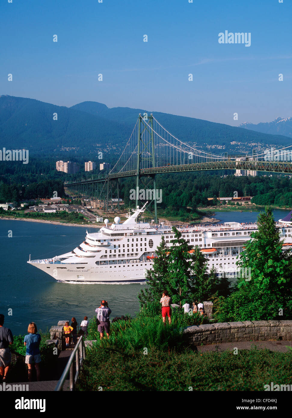 Passenger cruise ship in the Burrard Inlet passing under the Lions Gate Bridge, Vancouver, British Columbia, Canada. Stock Photo