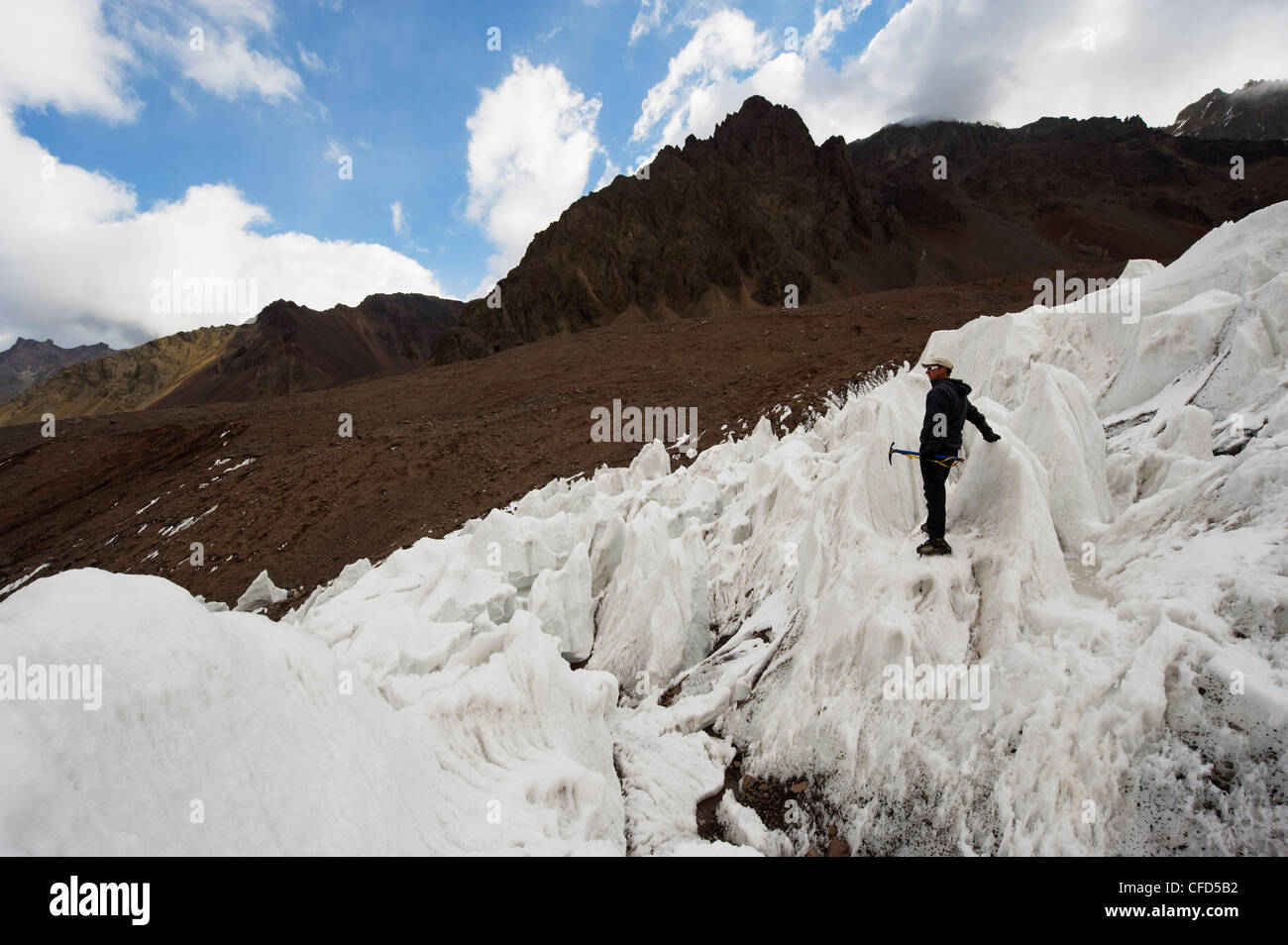 Climber ice climbing on glacier near Plaza de Mulas basecamp, Aconcagua Provincial Park, Andes mountains, Argentina Stock Photo
