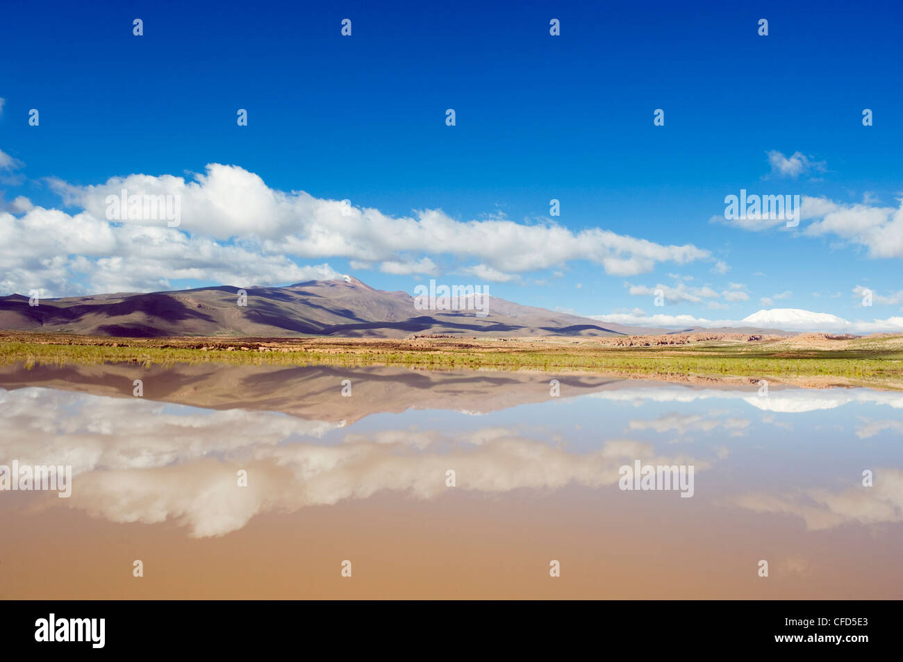 Mountain scenery reflecting in a lake, Altiplano, Bolivia, South America Stock Photo