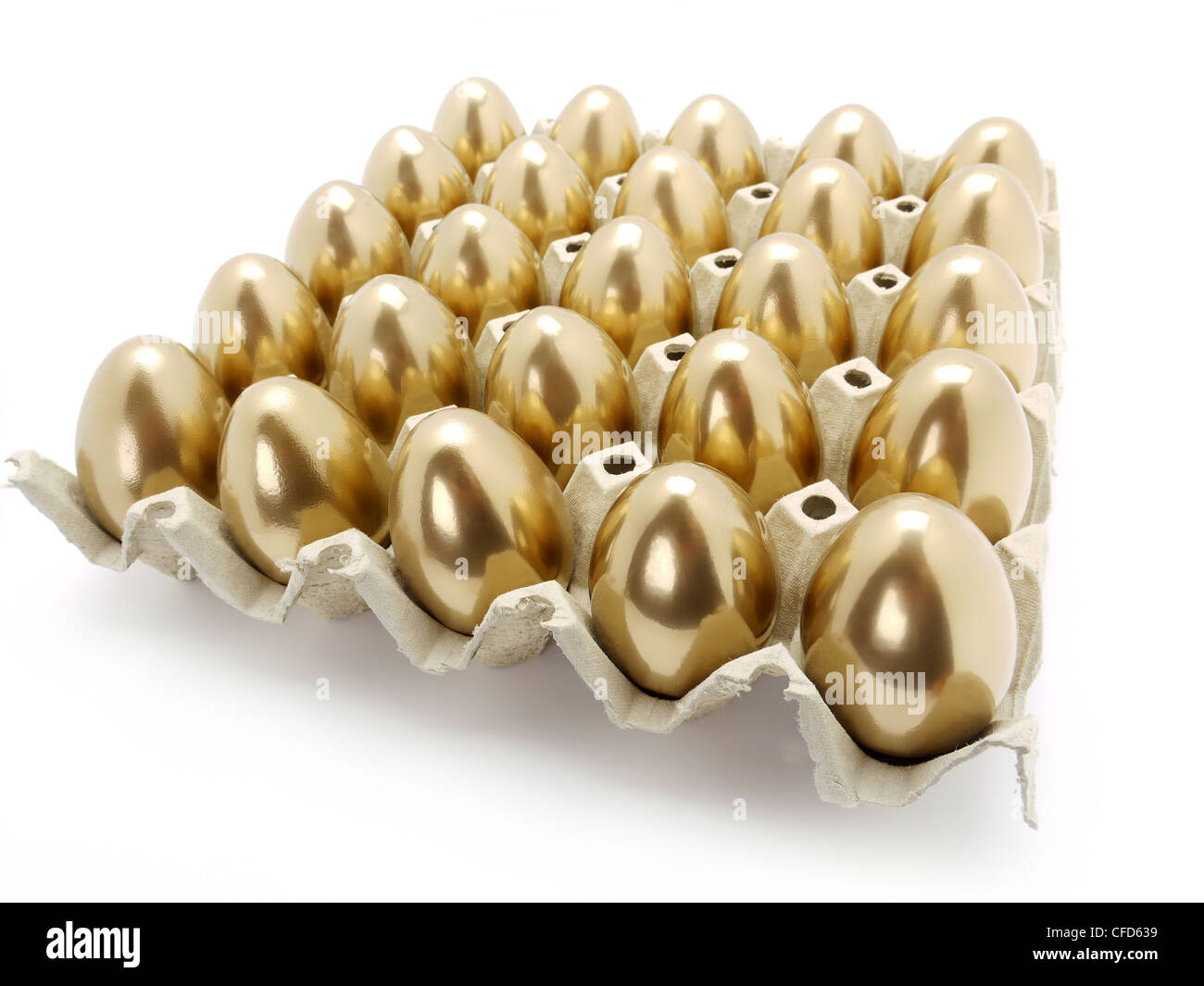 Many golden eggs in egg tray shot on white background Stock Photo