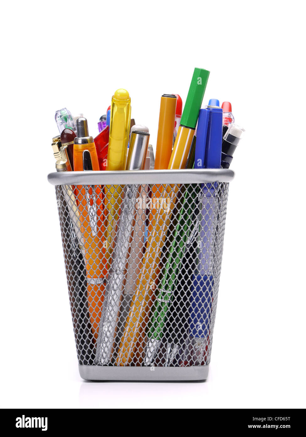 Metal mesh container full of writing tools shot over white background Stock Photo