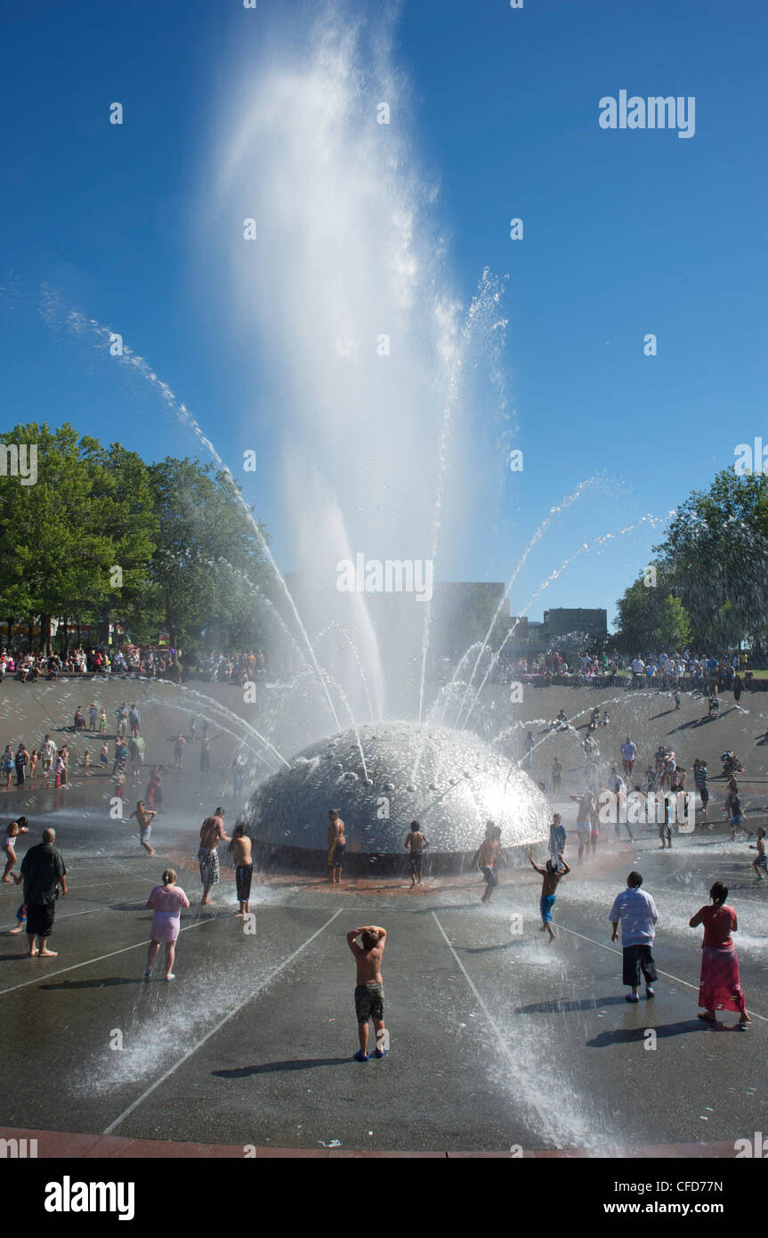 Children play in the Seattle Center Fountain on a hot summer day, Seattle, Washington State, United States of America Stock Photo